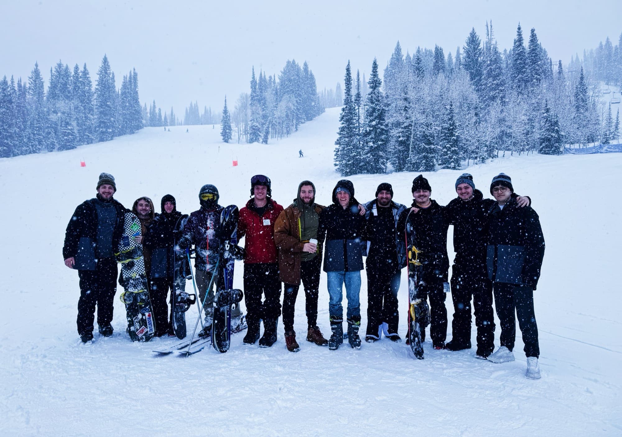 Elevate members snowboarding together